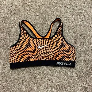 Orange and black Nike sports bra